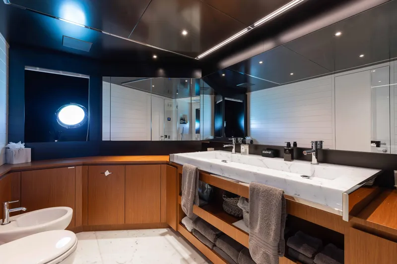Slide: The Image of Luxurious bathroom on 2020 Riva 90 Argo yacht with modern fixtures and elegant design. - 27