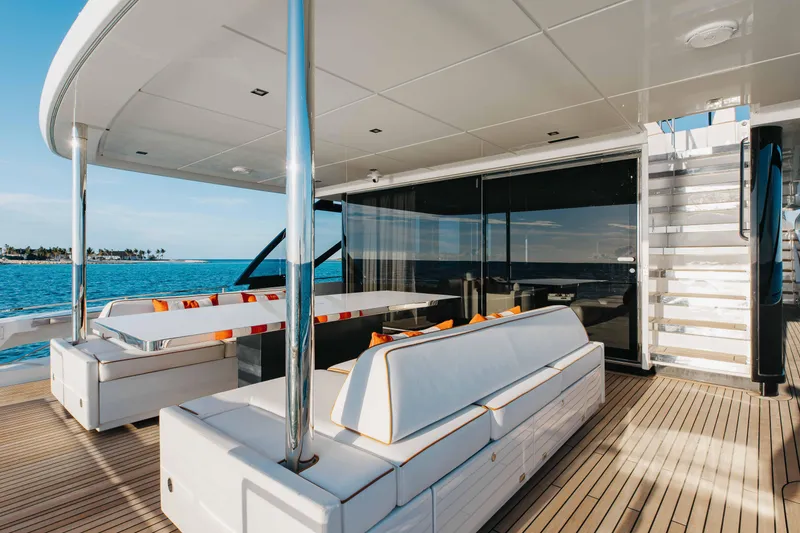 Slide: The Image of Luxurious 2020 Riva 90 Argo yacht deck with modern seating and ocean view. - 12