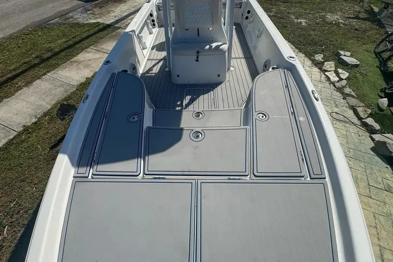 Slide: The Image of 2018 Blue Wave 2400 PureBay boat deck with storage compartments and seating. - 30