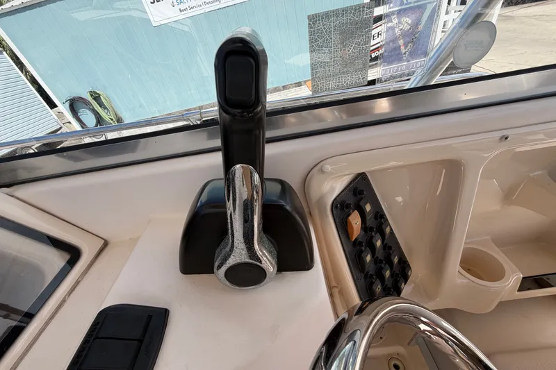 Slide: The Image of Close-up of 2008 Grady-White Seafarer 226 boat controls and dashboard. - 43