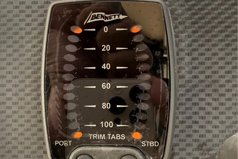 Slide: The Image of Bennett trim tabs control panel on 2008 Grady-White Seafarer 226 boat. - 42