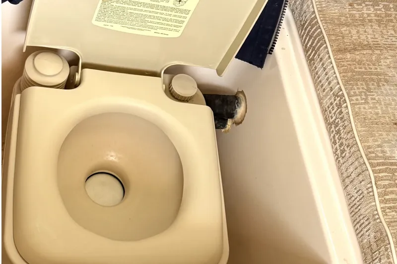 Slide: The Image of Portable toilet on 2008 Grady-White Seafarer 226 boat interior. - 33