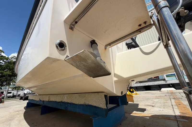 Slide: The Image of 2008 Grady-White Seafarer 226 boat on a stand, showing hull and fittings. - 65