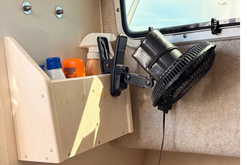 Slide: The Image of Interior of 2008 Grady-White Seafarer 226 with fan and storage shelf. - 30