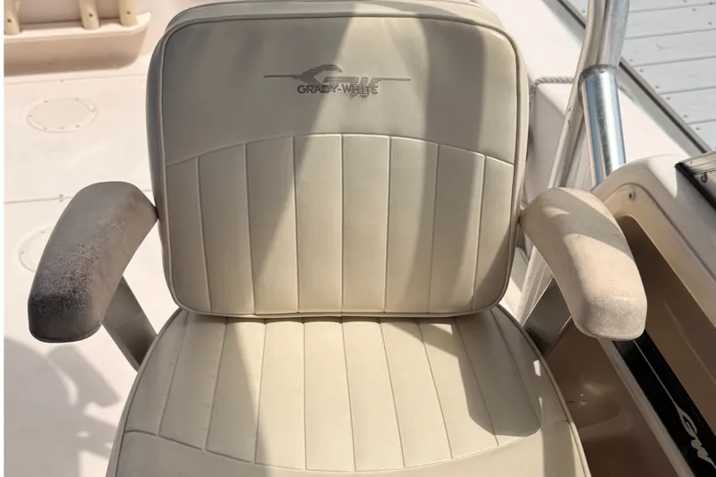 Slide: The Image of Grady-White Seafarer 226 boat seat, 2008 model, with beige upholstery and armrests. - 45