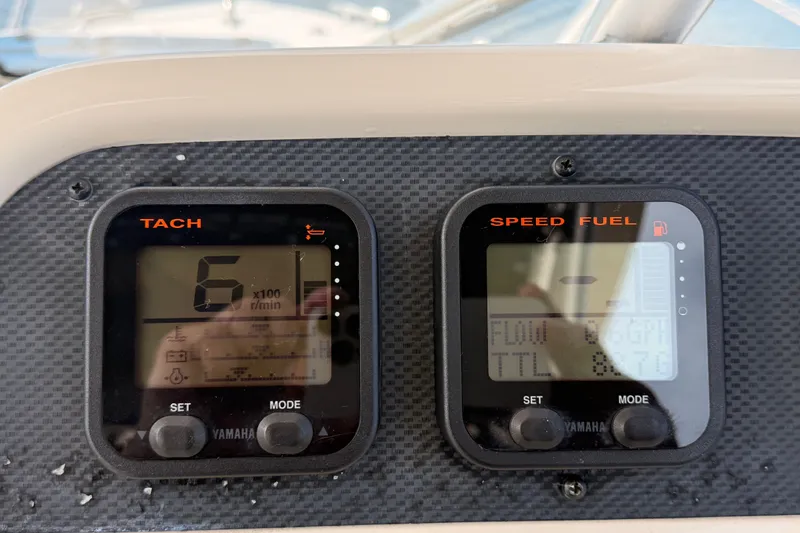 Slide: The Image of Dashboard of a 2008 Grady-White Seafarer 226 boat showing tachometer and fuel gauge. - 41