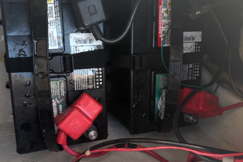 Slide: The Image of Marine batteries in a 2008 Grady-White Seafarer 226 boat, secured with straps. - 70