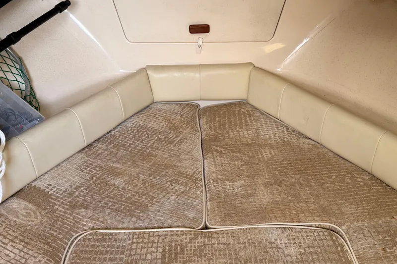 Slide: The Image of Interior cabin of 2008 Grady-White Seafarer 226 with cushioned seating and storage. - 26