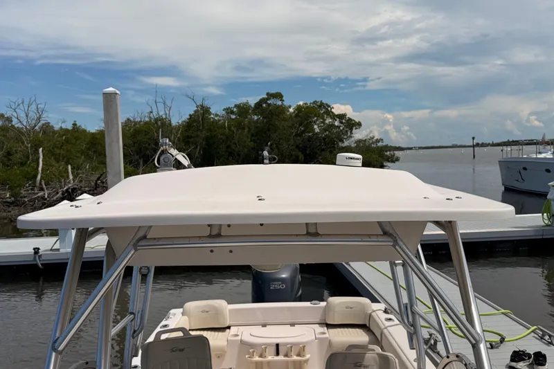 Slide: The Image of 2008 Grady-White Seafarer 226 boat docked by a scenic waterfront. - 19