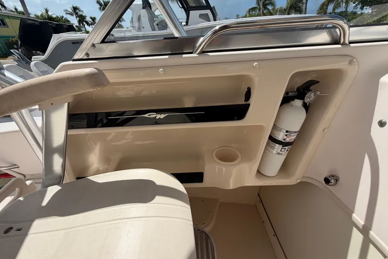 Slide: The Image of 2008 Grady-White Seafarer 226 boat interior with fire extinguisher and storage compartments. - 50