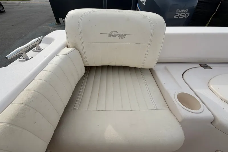 Slide: The Image of Grady-White Seafarer 228 boat seat, 2008 model, with cup holder and Yamaha engine in background. - 72