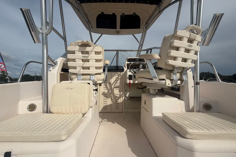 Slide: The Image of 2008 Grady-White Seafarer 228 boat interior with helm and seating. - 16