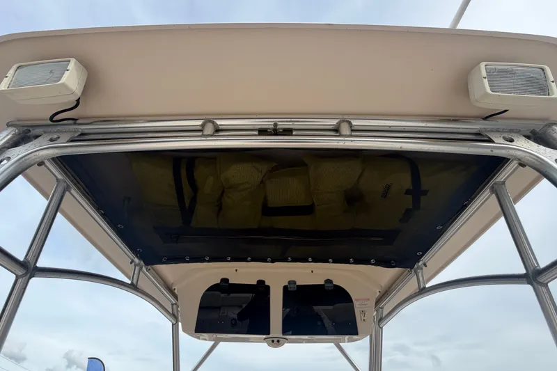 Slide: The Image of 2008 Grady-White Seafarer 228 boat canopy and storage view. - 35