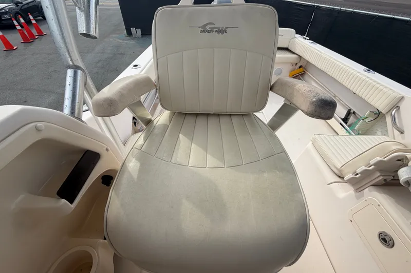 Slide: The Image of Grady-White Seafarer 228 boat seat, 2008 model, featuring cushioned armrests and beige upholstery. - 65