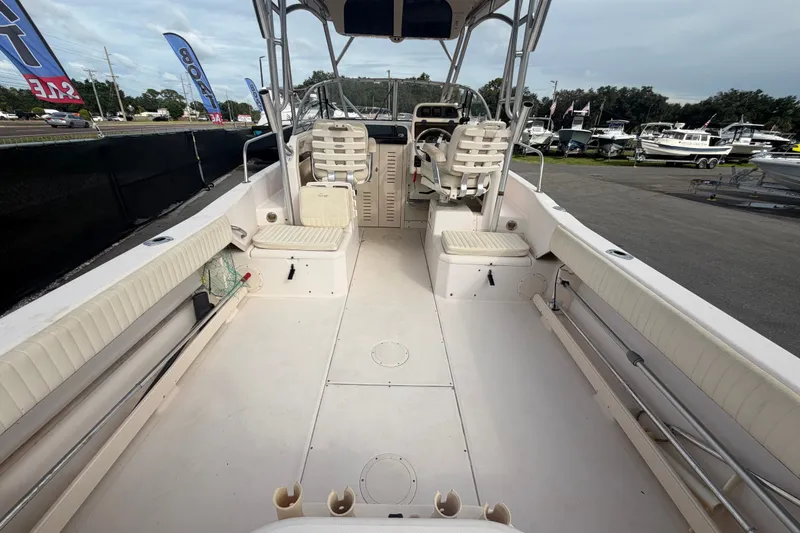Slide: The Image of 2008 Grady-White Seafarer 228 boat interior with seating and steering console. - 14