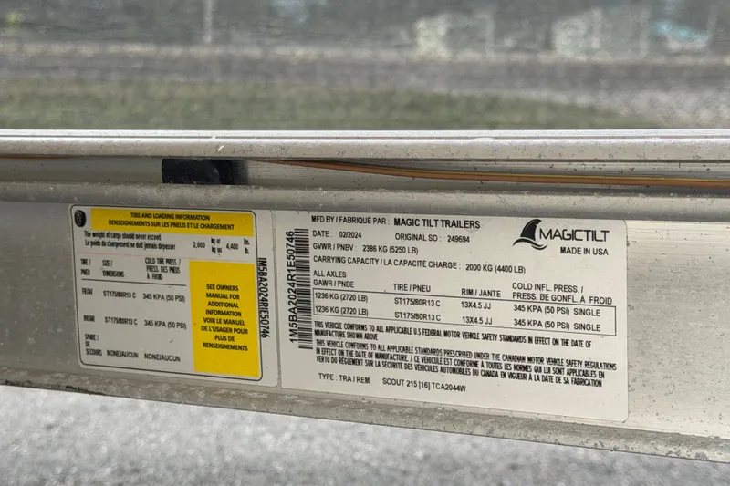 Slide: The Image of Magic Tilt trailer label with tire and loading information, Grady-White Seafarer 228, 2008 model. - 89