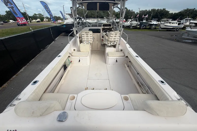 Slide: The Image of 2008 Grady-White Seafarer 228 boat interior, showcasing spacious seating and helm area. - 12