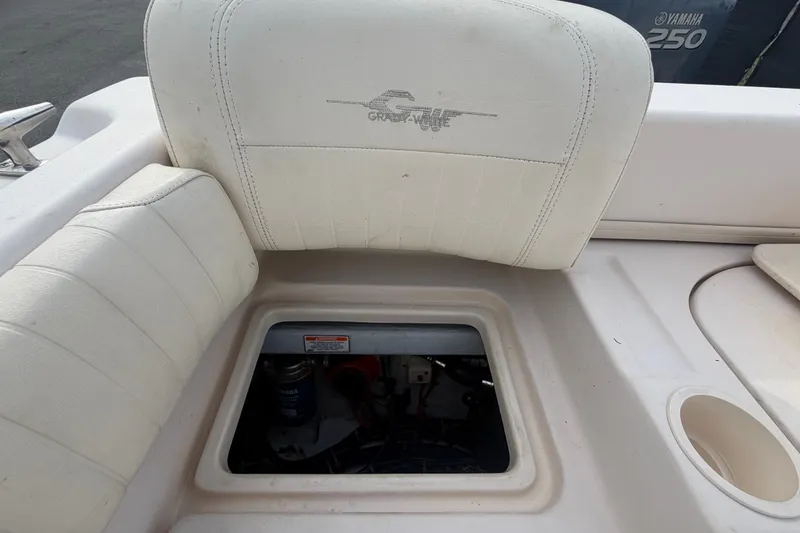 Slide: The Image of 2008 Grady-White Seafarer 228 boat interior with open hatch and Yamaha engine. - 75