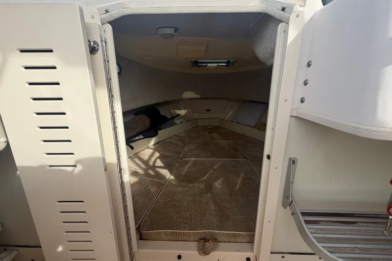 Slide: The Image of Interior cabin of 2008 Grady-White Seafarer 228 boat, featuring cozy seating and cushions. - 45