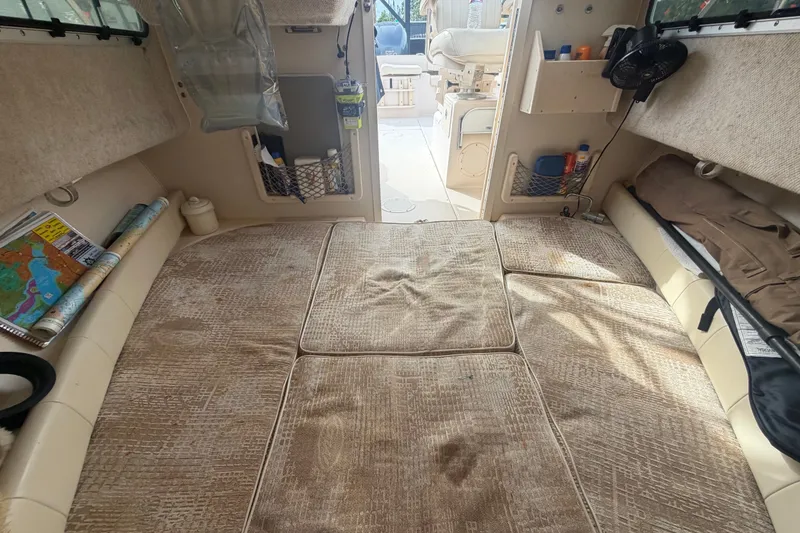 Slide: The Image of Interior cabin of a 2008 Grady-White Seafarer 228 boat with seating and storage. - 52