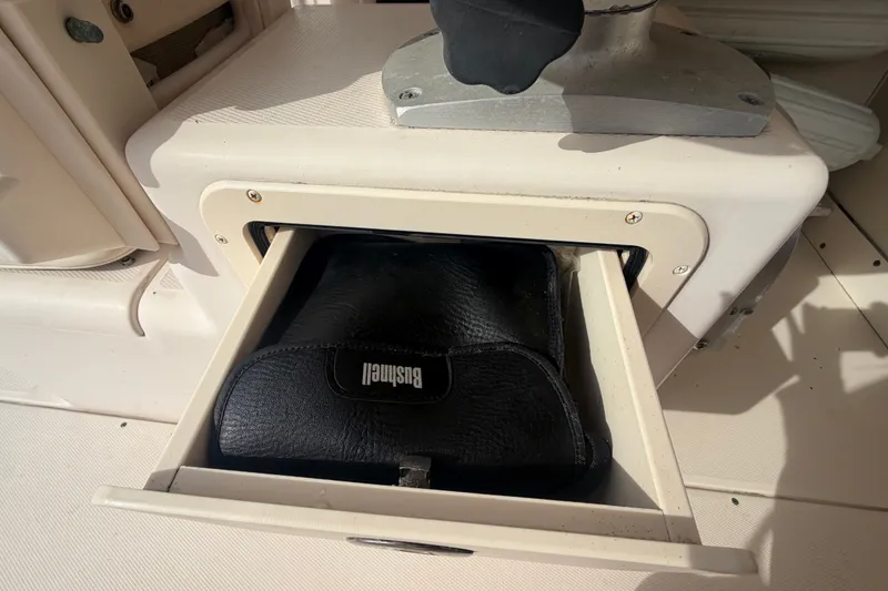 Slide: The Image of Open drawer on 2008 Grady-White Seafarer 228 boat with Bushnell case inside. - 30