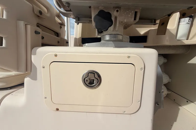 Slide: The Image of 2008 Grady-White Seafarer 228 boat interior storage compartment with latch. - 29