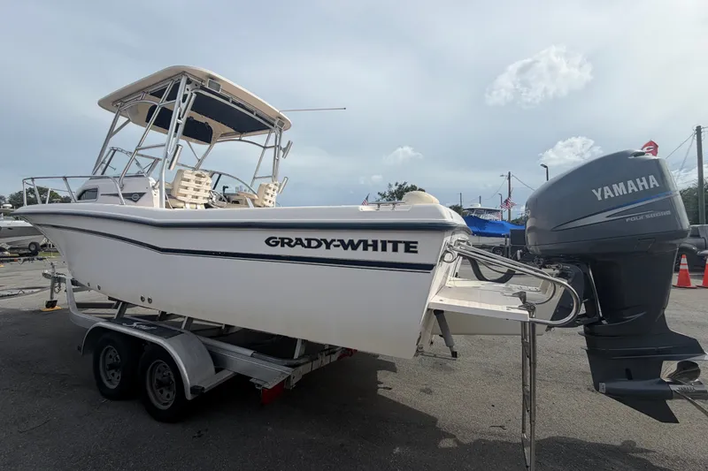 Slide: The Image of 2008 Grady-White Seafarer 228 boat with Yamaha engine on trailer, outdoor setting. - 7