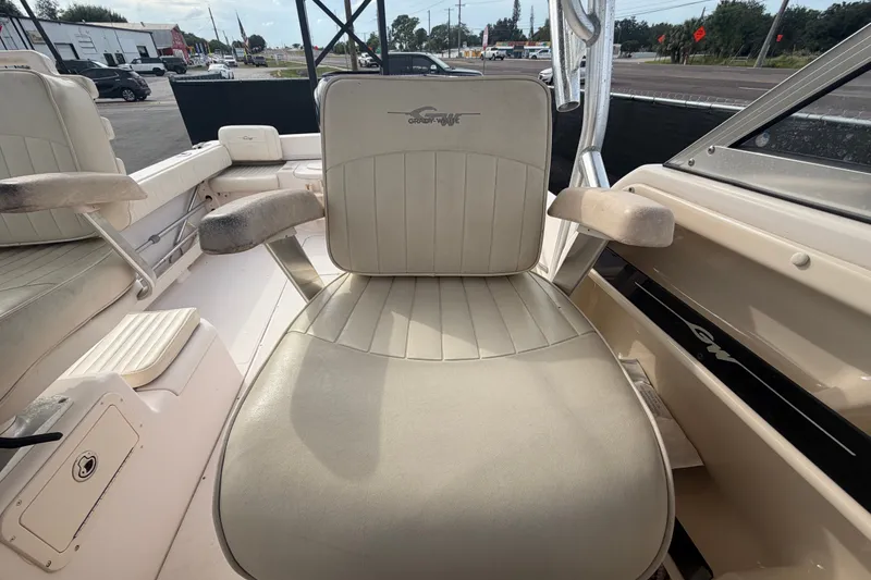 Slide: The Image of 2008 Grady-White Seafarer 228 boat interior with beige seating and armrests. - 64