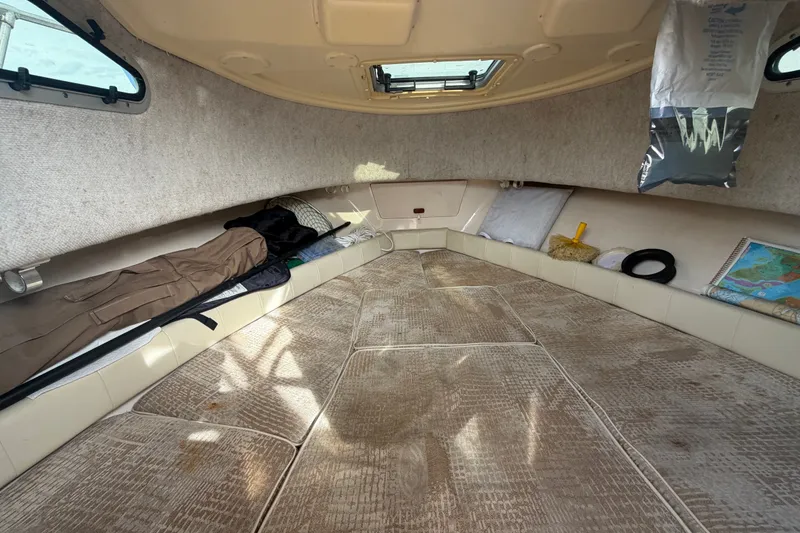 Slide: The Image of Interior cabin of 2008 Grady-White Seafarer 228 boat, featuring cozy sleeping area. - 49