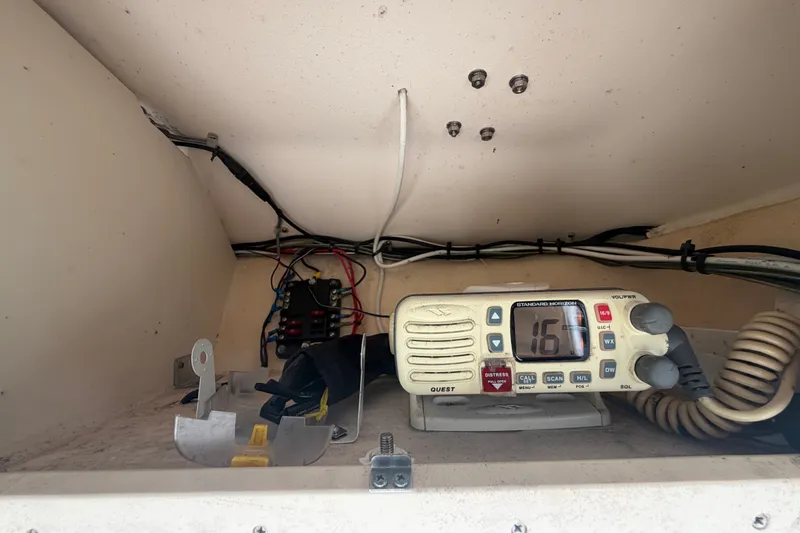 Slide: The Image of 2008 Grady-White Seafarer 228 boat interior with radio and wiring. - 33