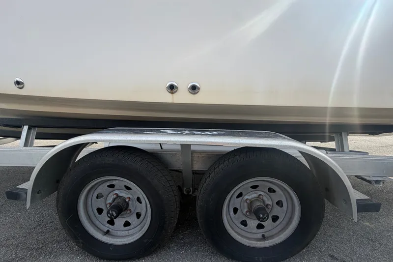 Slide: The Image of Trailer with Grady-White Seafarer 228 boat, 2008 model, parked on pavement. - 92