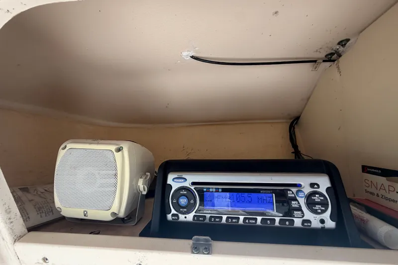 Slide: The Image of Boat cabin with a Jensen stereo system and speaker, Grady-White Seafarer 228, 2008 model. - 34