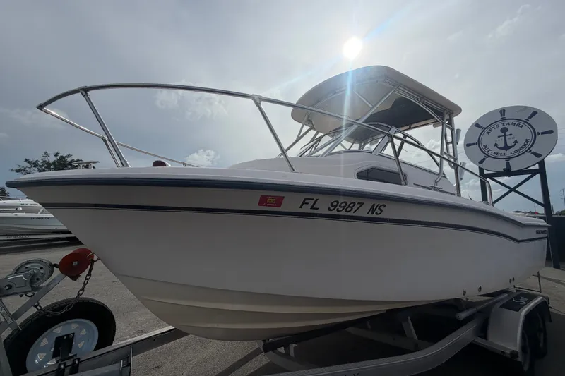 Slide: The Image of 2008 Grady-White Seafarer 228 boat on trailer under sunny sky. - 9