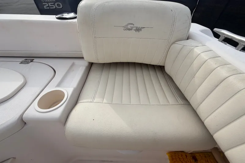 Slide: The Image of White seating on a 2008 Grady-White Seafarer 228 boat, featuring a Yamaha 250 engine. - 79
