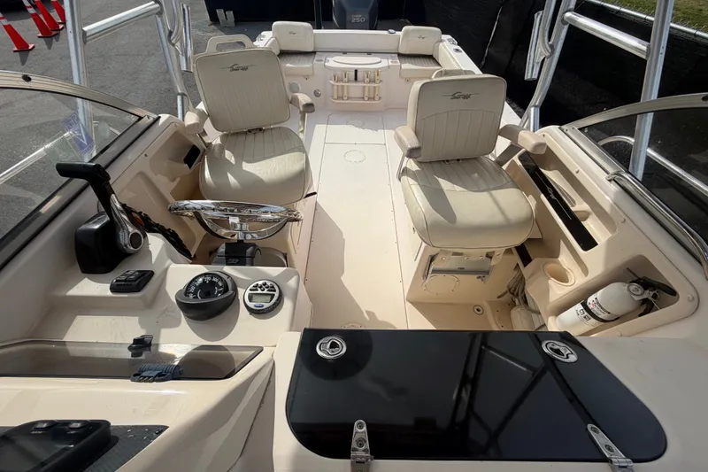 Slide: The Image of 2008 Grady-White Seafarer 228 boat interior with steering wheel, seating, and control panel. - 62