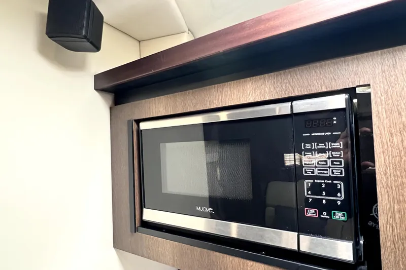 Slide: The Image of Built-in microwave in 2018 Monterey 355 Sport Yacht kitchen area. - 99