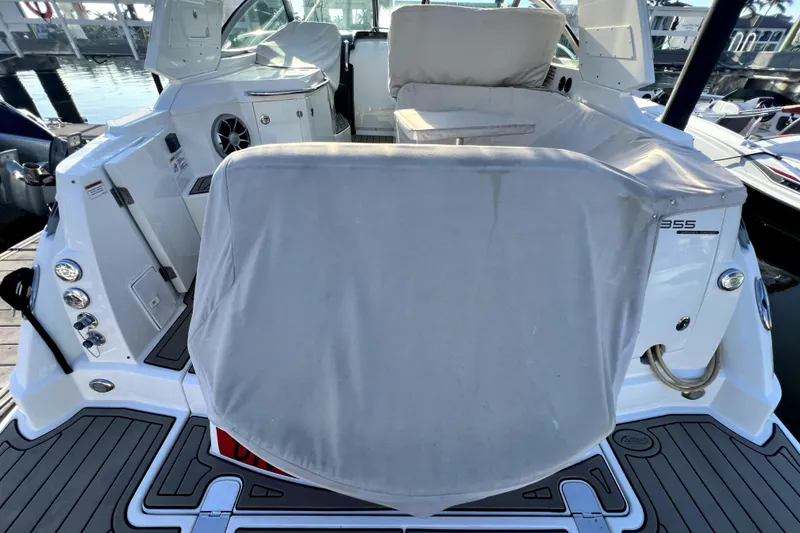 Slide: The Image of 2018 Monterey 355 Sport Yacht rear view with covered seating area at dock. - 36