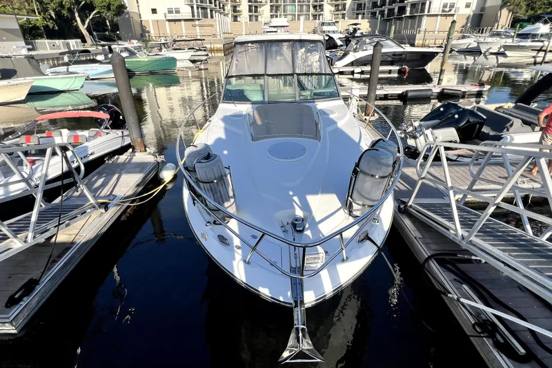 Slide: The Image of 2018 Monterey 355 Sport Yacht docked at marina, surrounded by other boats. - 77