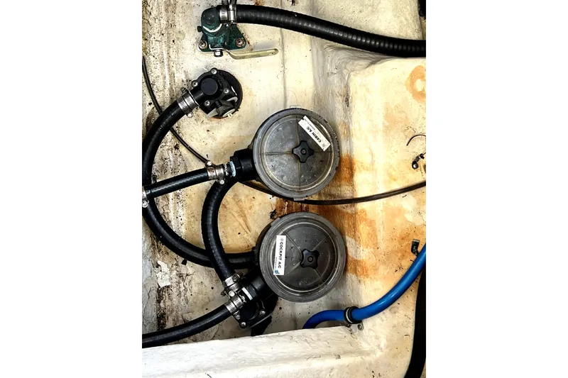 Slide: The Image of Engine compartment of a 2018 Monterey 355 Sport Yacht with hoses and filters. - 112