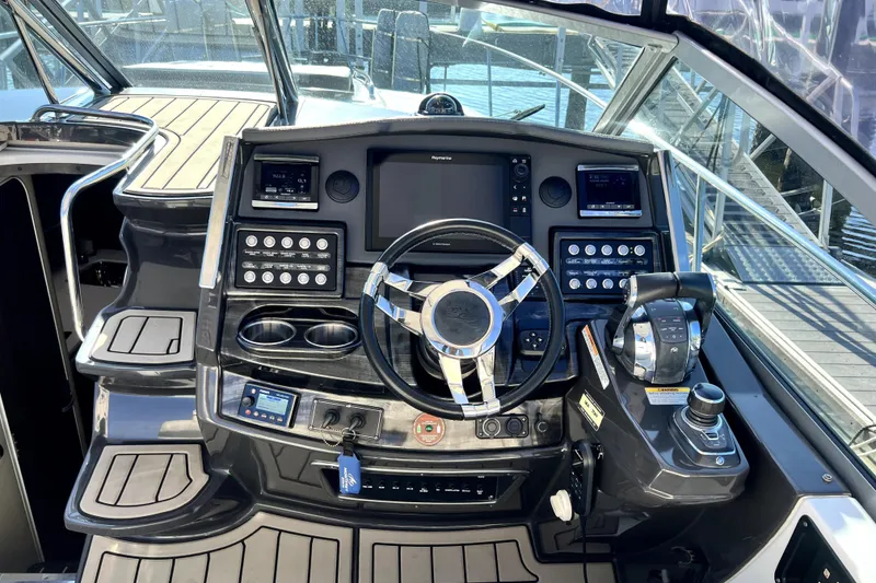Slide: The Image of Cockpit of 2018 Monterey 355 Sport Yacht with modern controls and steering wheel. - 67