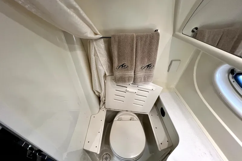 Slide: The Image of Bathroom interior of 2018 Monterey 355 Sport Yacht with towels and toilet. - 47
