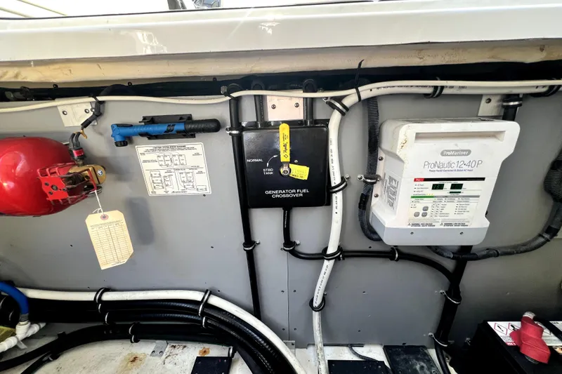 Slide: The Image of Engine compartment of a 2018 Monterey 355 Sport Yacht with electrical and safety equipment. - 115