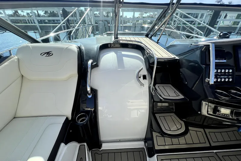 Slide: The Image of Cockpit of 2018 Monterey 355 Sport Yacht with luxurious seating and modern controls. - 103