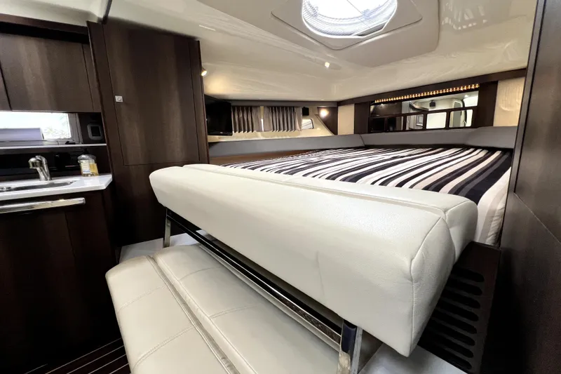 Slide: The Image of Luxurious interior of 2018 Monterey 355 Sport Yacht with modern kitchen and cozy sleeping area. - 52