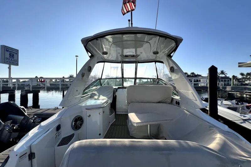 Slide: The Image of 2018 Monterey 355 Sport Yacht docked at marina, featuring spacious seating and sleek design. - 37