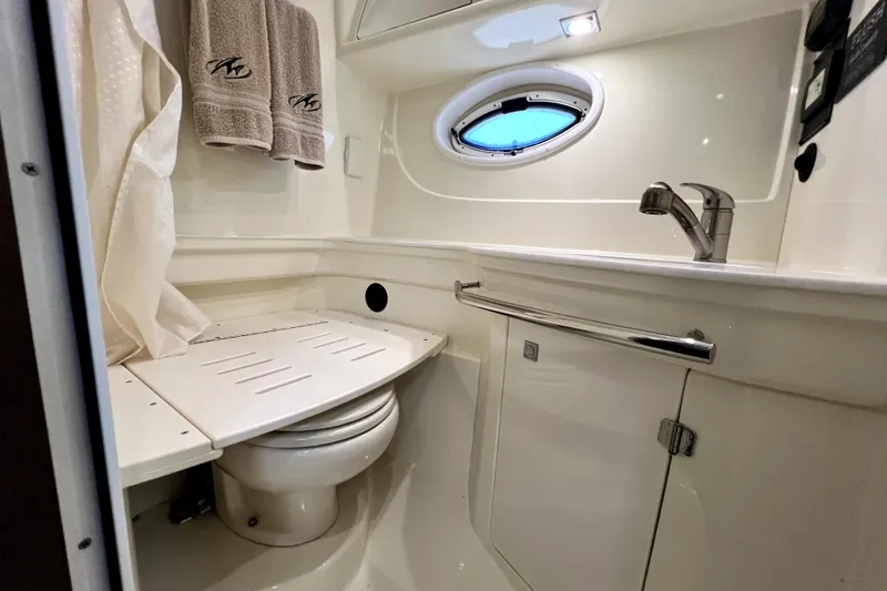 Slide: The Image of Bathroom interior of 2018 Monterey 355 Sport Yacht with porthole and modern fixtures. - 39