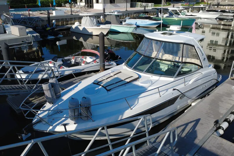 Slide: The Image of 2018 Monterey 355 Sport Yacht docked at marina, surrounded by other boats. - 18