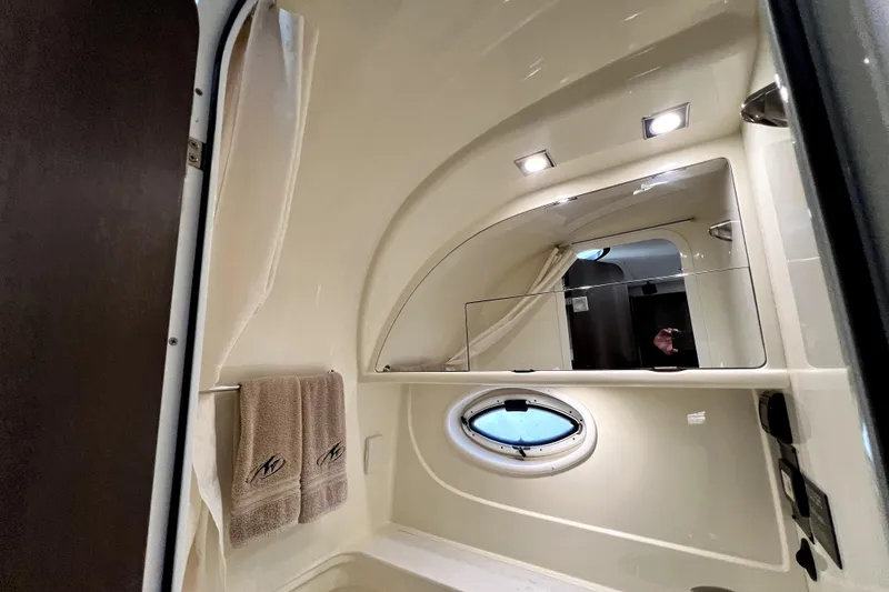 Slide: The Image of Luxurious bathroom interior of 2018 Monterey 355 Sport Yacht with elegant fixtures and lighting. - 44