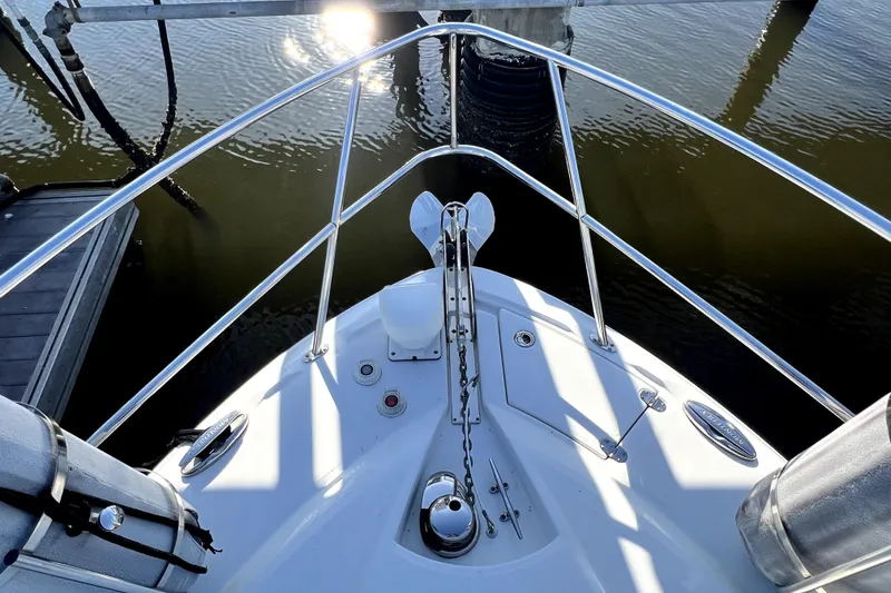 Slide: The Image of Bow view of 2018 Monterey 355 Sport Yacht docked on calm water. - 130