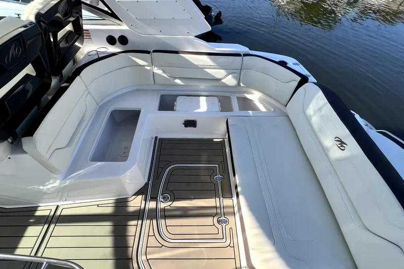 Slide: The Image of Luxurious seating area on a 2018 Monterey 355 Sport Yacht, docked by the water. - 111